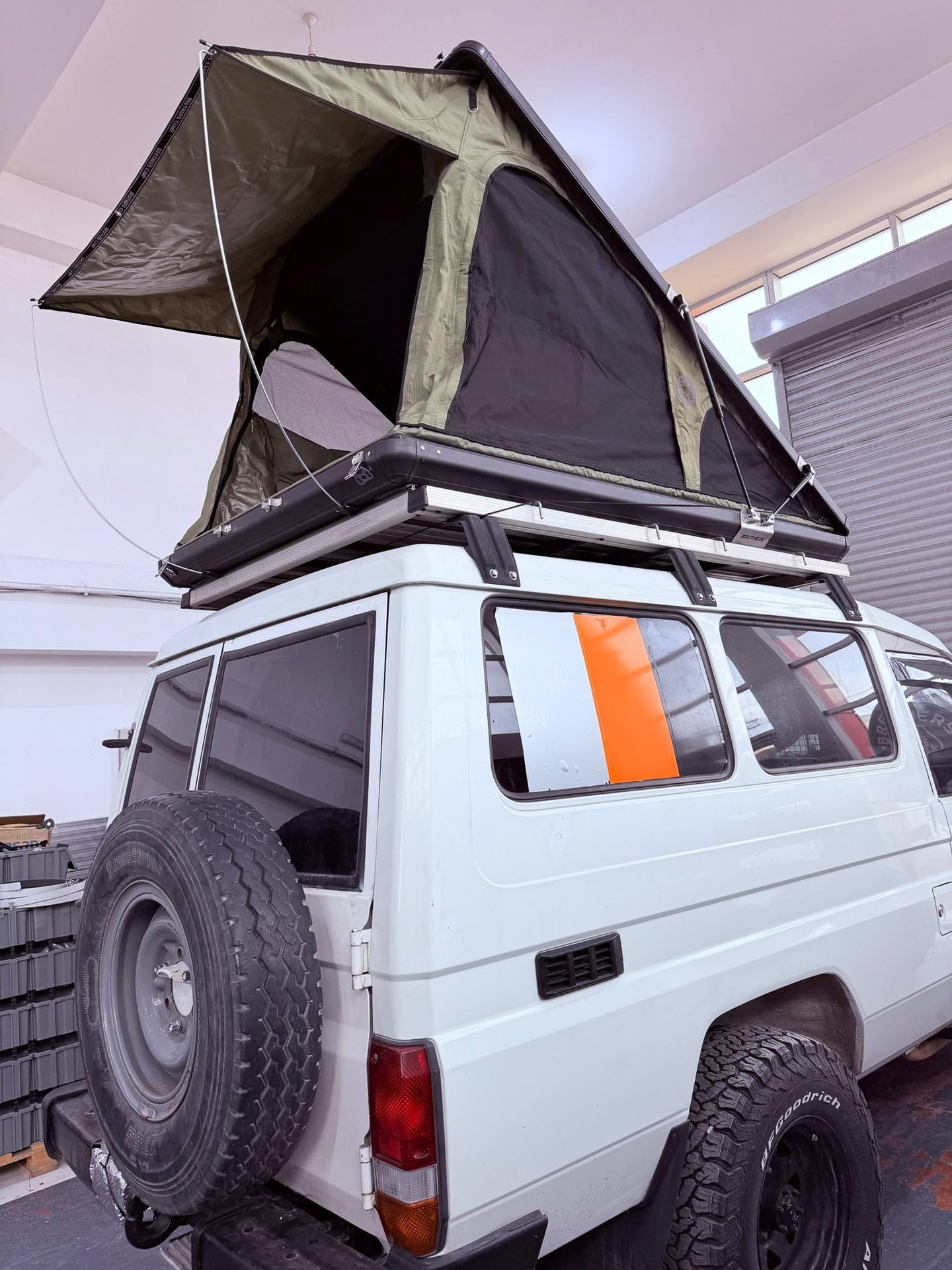 Brothers Camp aluminium hard shell rooftop tent triangle setup for overlanding and camping